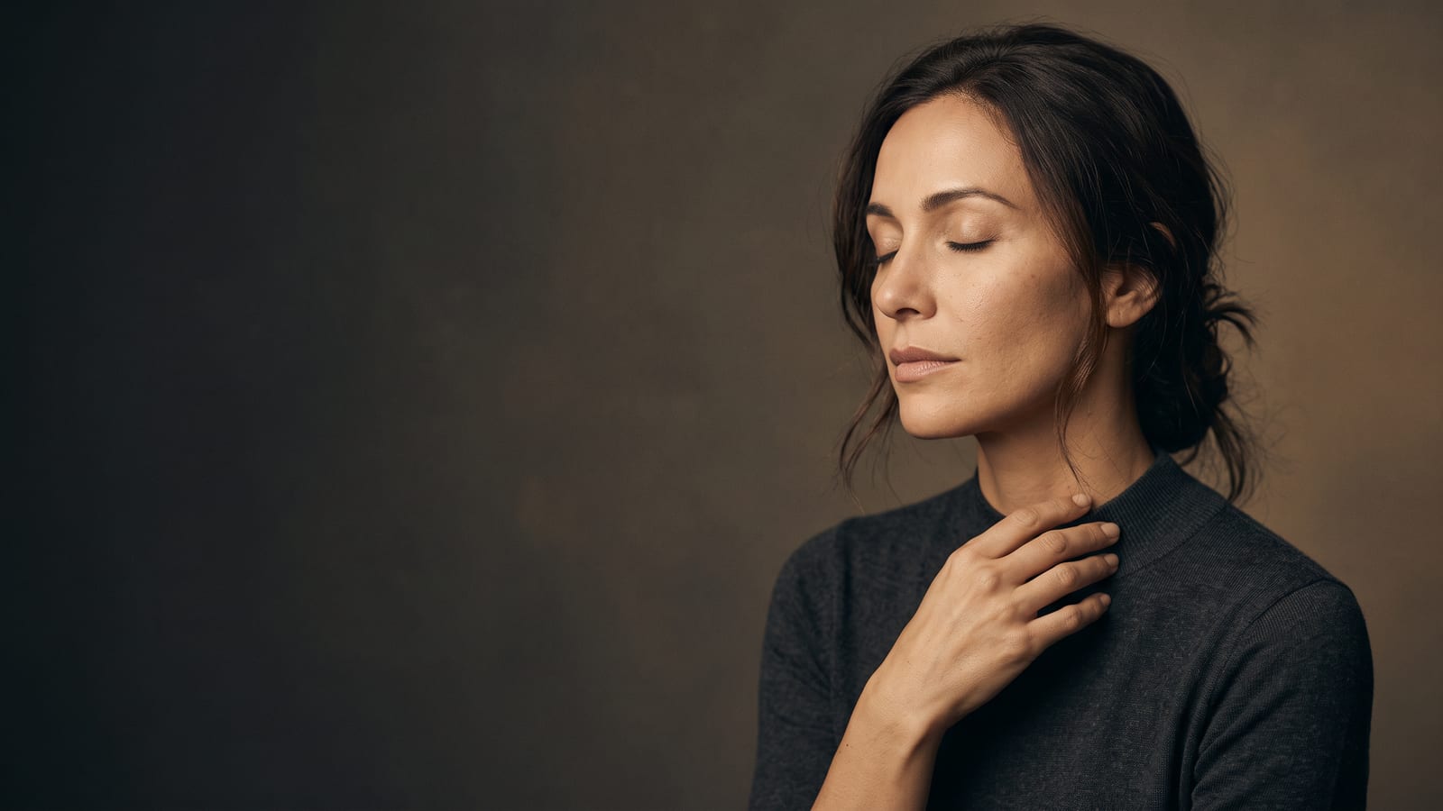 Woman resting calmly with her eyes closed and a hand at her collarbone in the hours after Botox, at a Highland Park med spa
