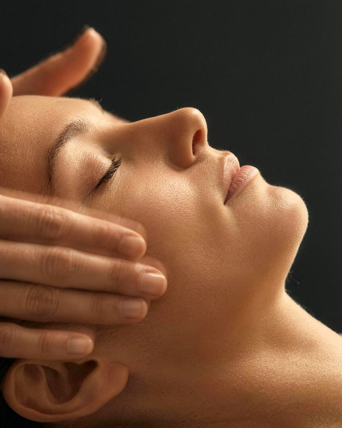 Hands-on work across the cheeks and jaw during the Classic Facial at DK Aesthetics Highland Park IL