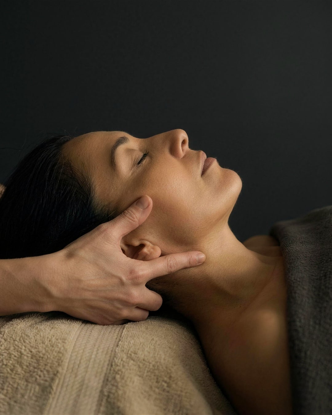Hands-on work along the cheeks and cheekbones during the Classic Facial at DK Aesthetics Highland Park IL